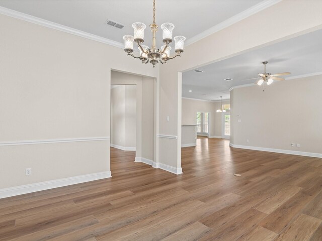 spare room with ornamental molding and visible vents