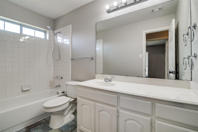 full bathroom with shower / bath combination, visible vents, toilet, and vanity