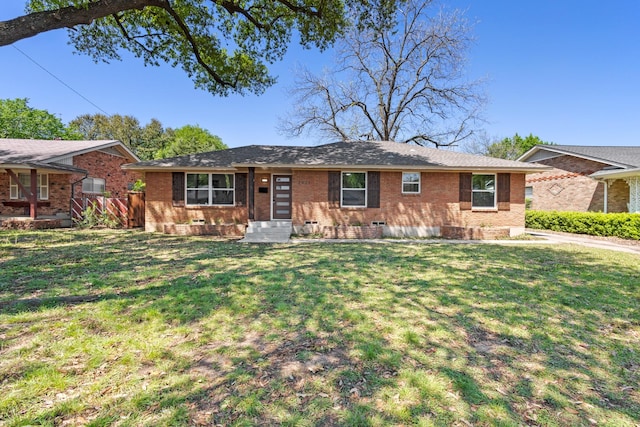 ranch-style house with a front lawn and brick siding