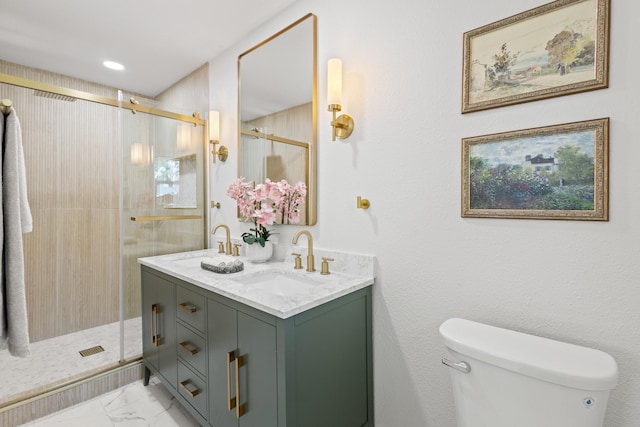 bathroom featuring a sink, double vanity, toilet, marble finish floor, and a shower stall