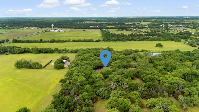 birds eye view of property with a rural view