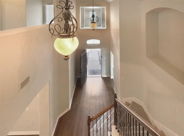 1005 Lake Hollow Dr, Little Elm, TX 75068 - interior space featuring a high ceiling, wood finished floors, visible vents, arched walkways, and baseboards