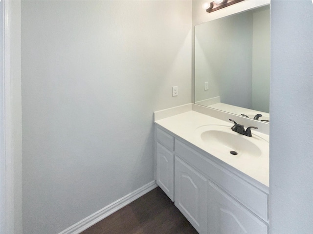 1005 Lake Hollow Dr, Little Elm, TX 75068 - bathroom with baseboards, wood finished floors, and vanity