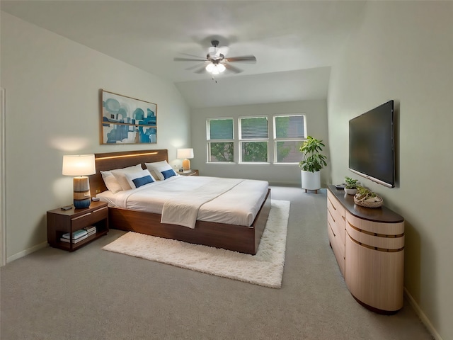1005 Lake Hollow Dr, Little Elm, TX 75068 - bedroom featuring a ceiling fan, vaulted ceiling, light colored carpet, and baseboards