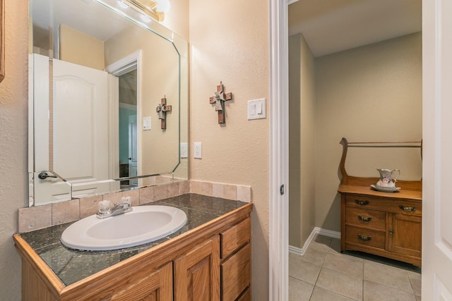 1944 Nottingham Dr, Kaufman, TX 75142 - bathroom with baseboards, a textured wall, vanity, and tile patterned flooring