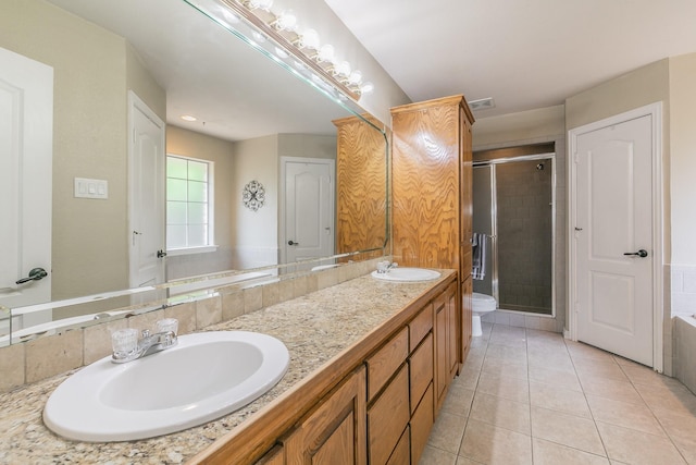 1944 Nottingham Dr, Kaufman, TX 75142 - bathroom with double vanity, a sink, visible vents, and a stall shower