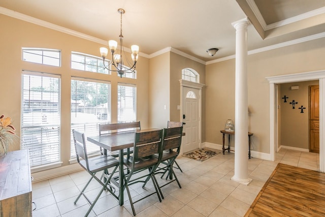 1944 Nottingham Dr, Kaufman, TX 75142 - dining area featuring a healthy amount of sunlight, ornate columns, ornamental molding, and light tile patterned floors