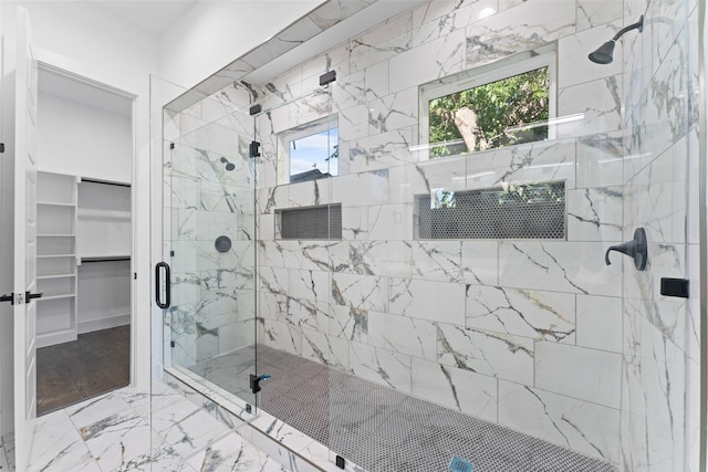 1822 Bickers St, Dallas, TX 75212 - full bath featuring a marble finish shower, marble look tile flooring, and a walk in closet