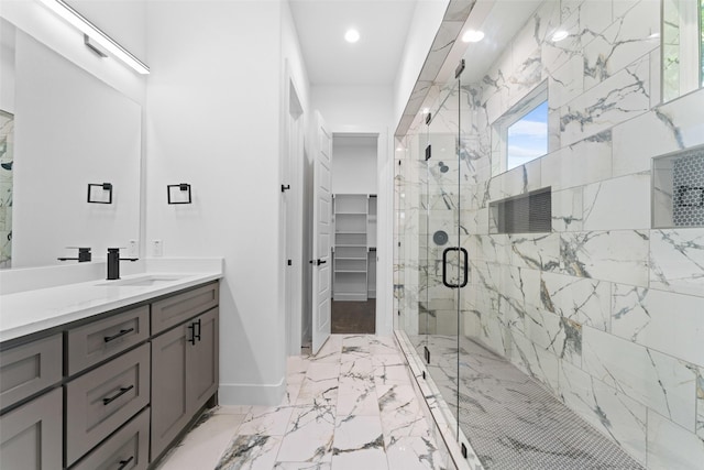 1822 Bickers St, Dallas, TX 75212 - full bathroom featuring vanity, a marble finish shower, baseboards, marble finish floors, and a spacious closet