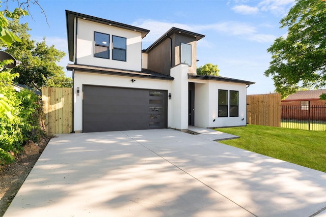 1822 Bickers St, Dallas, TX 75212 - modern home featuring stucco siding, driveway, and a garage