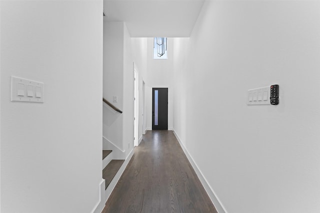 1822 Bickers St, Dallas, TX 75212 - hall featuring dark wood-type flooring, stairs, baseboards, and a high ceiling