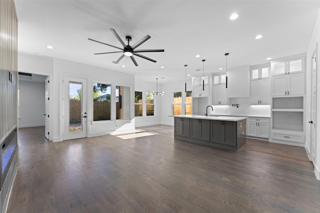 1822 Bickers St, Dallas, TX 75212 - kitchen featuring recessed lighting, open floor plan, a center island with sink, white cabinets, and light countertops