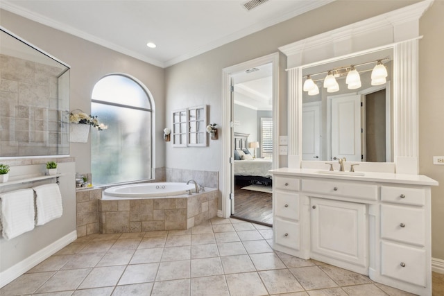 ensuite bathroom with a garden tub, crown molding, tile patterned floors, vanity, and ensuite bath