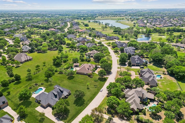 aerial view featuring a residential view and a water view