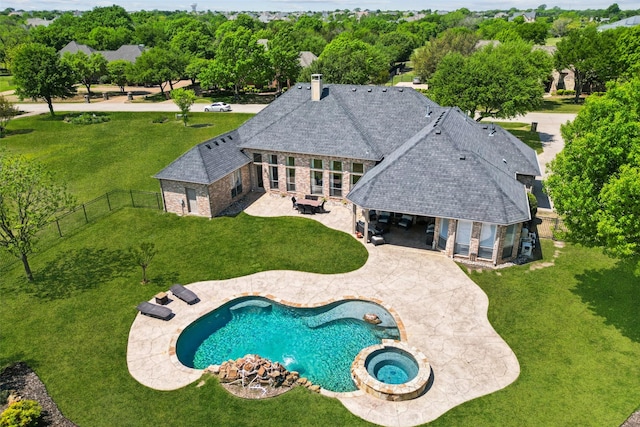 view of pool featuring a patio area, a fenced backyard, and a yard