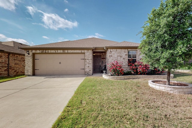 single story home featuring an attached garage, brick siding, a front yard, and concrete driveway