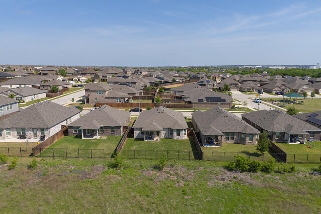 birds eye view of property with a residential view
