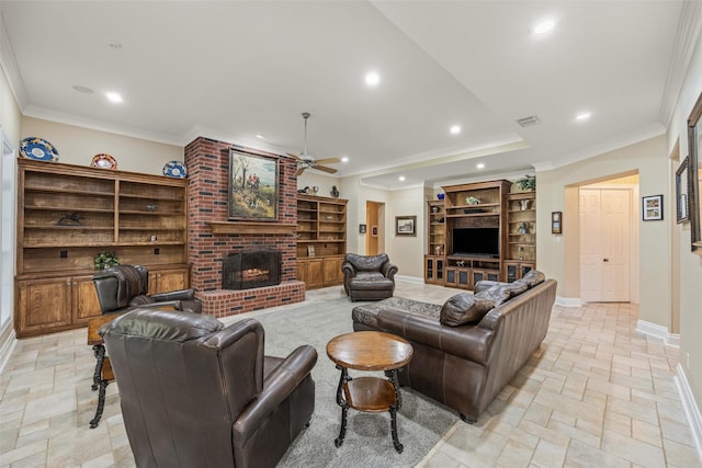 living area featuring recessed lighting, crown molding, baseboards, a brick fireplace, and ceiling fan