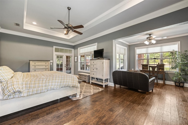 bedroom with hardwood / wood-style flooring, french doors, baseboards, ornamental molding, and visible vents