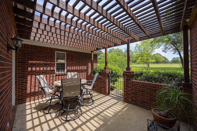 view of patio with a pergola and outdoor dining space