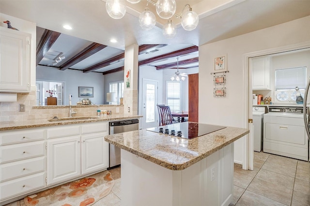 kitchen with black electric cooktop, beam ceiling, a sink, independent washer and dryer, and dishwasher