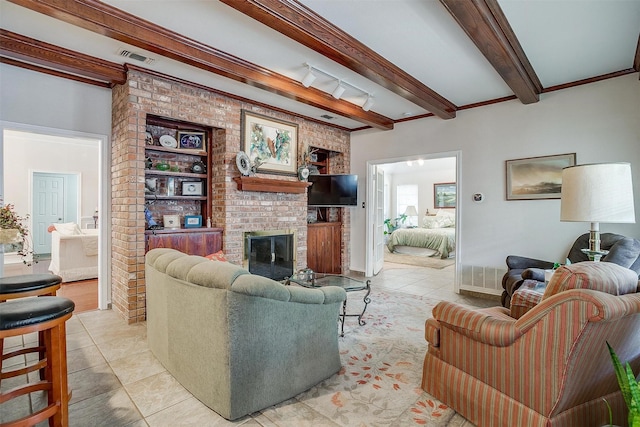 living area with light tile patterned flooring, a brick fireplace, visible vents, and beamed ceiling