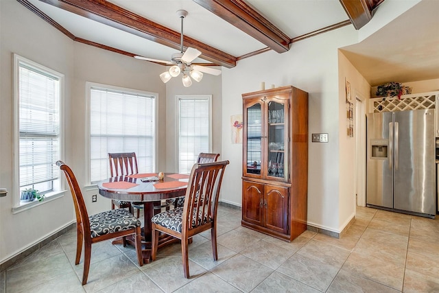 dining space with beamed ceiling, light tile patterned flooring, baseboards, and ceiling fan