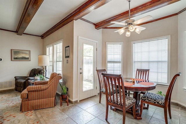 dining area with visible vents, a ceiling fan, light tile patterned floors, beam ceiling, and baseboards