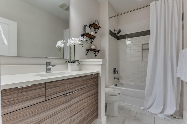 full bathroom with vanity, marble finish floor, shower / tub combo, toilet, and visible vents