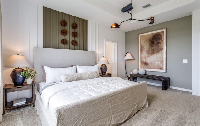 bedroom featuring baseboards, visible vents, and carpet