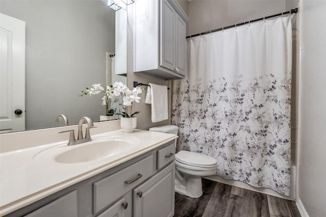 604 Lake Village Dr, Mckinney, TX 75071 - full bath featuring wood finished floors, toilet, vanity, and shower / bathtub combination with curtain