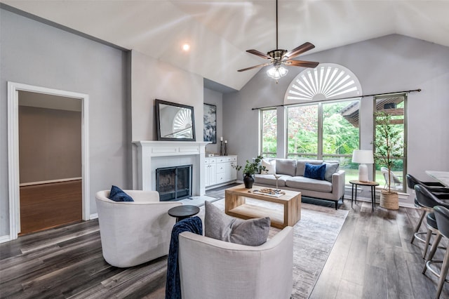 604 Lake Village Dr, Mckinney, TX 75071 - living area featuring lofted ceiling, a tiled fireplace, dark wood finished floors, and a ceiling fan