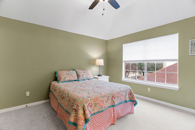 bedroom with vaulted ceiling, carpet, a ceiling fan, and baseboards