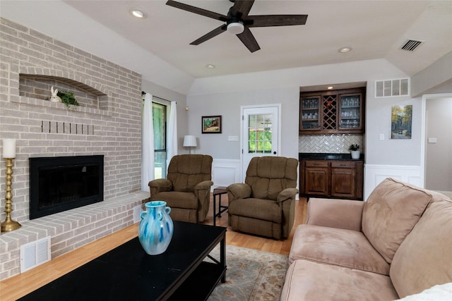 129 Highland Dr, Aledo, TX 76008 - living area with a wainscoted wall, a decorative wall, light wood finished floors, and visible vents