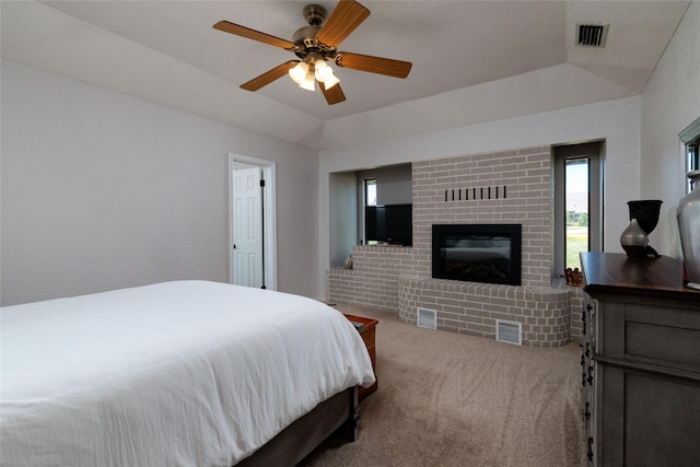 129 Highland Dr, Aledo, TX 76008 - bedroom with a brick fireplace, ceiling fan, visible vents, and carpet floors
