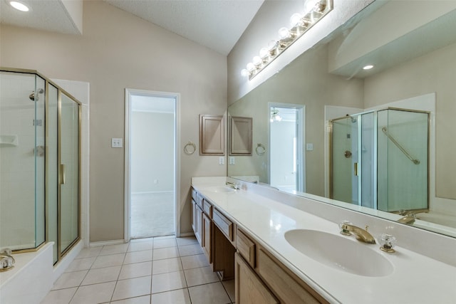 bathroom with lofted ceiling, a sink, and a shower stall