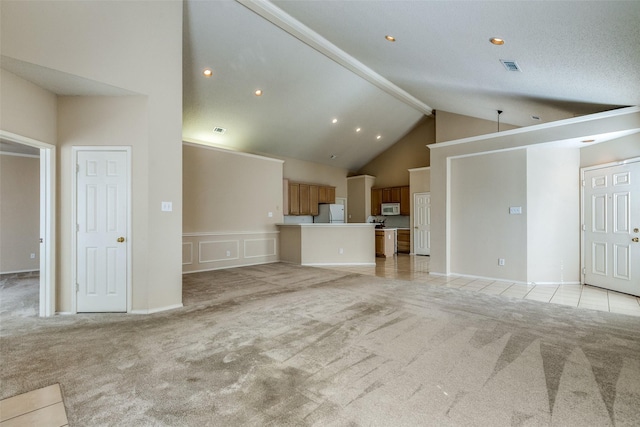 unfurnished living room with high vaulted ceiling, light carpet, beamed ceiling, visible vents, and recessed lighting