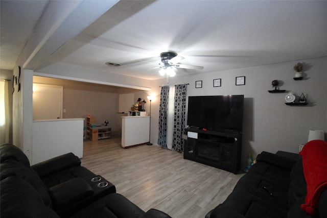 1281 W Eden St, Munday, TX 76371 - living room with ceiling fan and light wood-style flooring