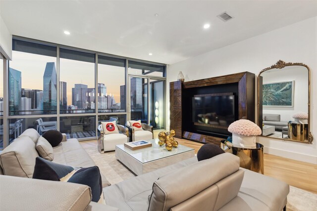 2200 Victory Ave Unit 2003, Dallas, TX 75219 - living room featuring floor to ceiling windows, wood finished floors, and recessed lighting