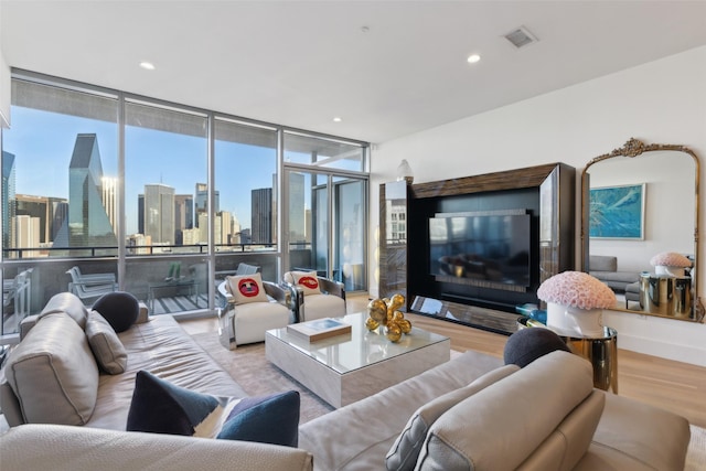 2200 Victory Ave Unit 2003, Dallas, TX 75219 - living area with wood finished floors, recessed lighting, and expansive windows