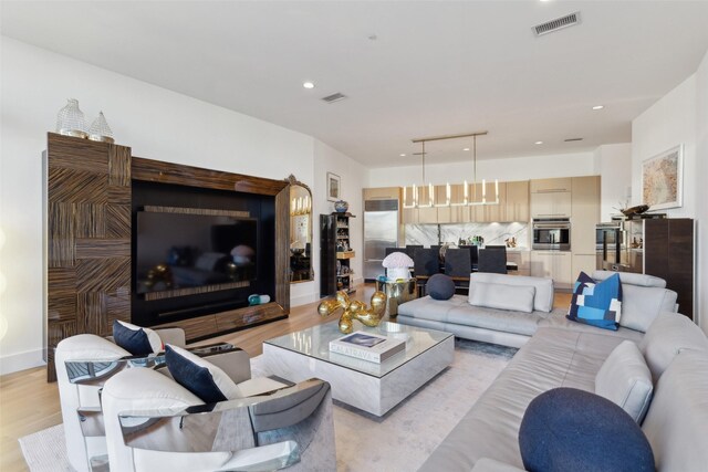 2200 Victory Ave Unit 2003, Dallas, TX 75219 - living area featuring light wood-style flooring and recessed lighting