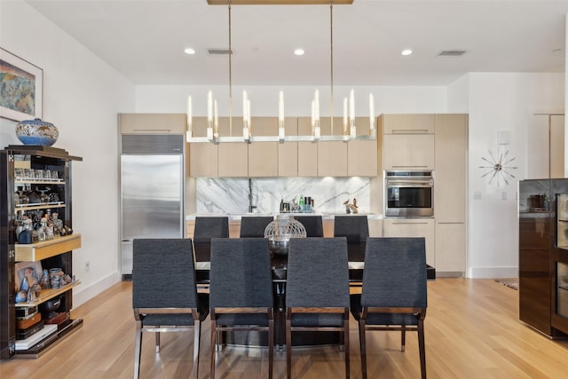2200 Victory Ave Unit 2003, Dallas, TX 75219 - dining area with light wood finished floors, baseboards, and recessed lighting