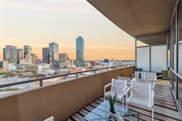 2200 Victory Ave Unit 2003, Dallas, TX 75219 - balcony at dusk with a skyline view