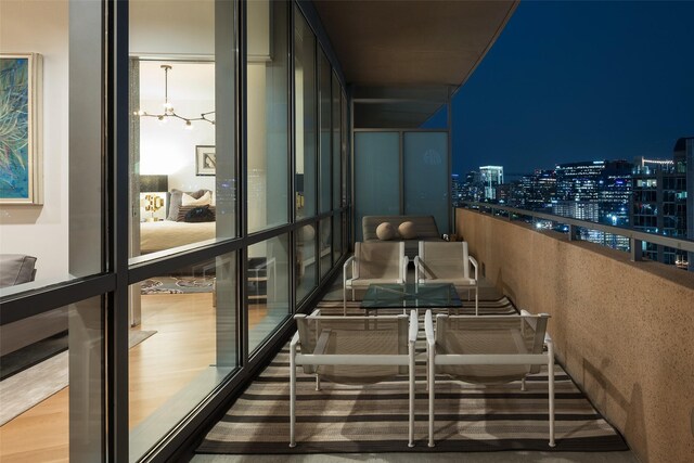 2200 Victory Ave Unit 2003, Dallas, TX 75219 - balcony at twilight featuring a view of city lights