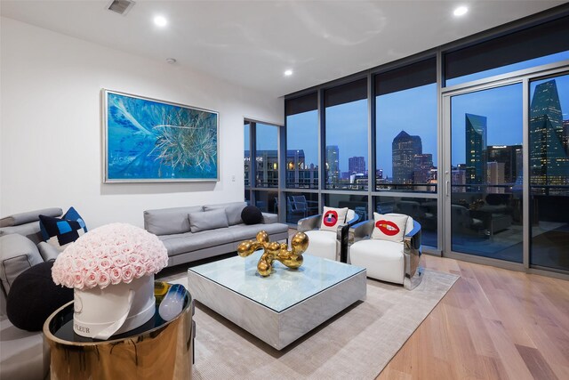 2200 Victory Ave Unit 2003, Dallas, TX 75219 - living room with wood finished floors, a view of skyline, floor to ceiling windows, and recessed lighting