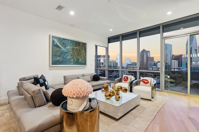 2200 Victory Ave Unit 2003, Dallas, TX 75219 - living area featuring wood finished floors, a wall of windows, a skyline view, and recessed lighting