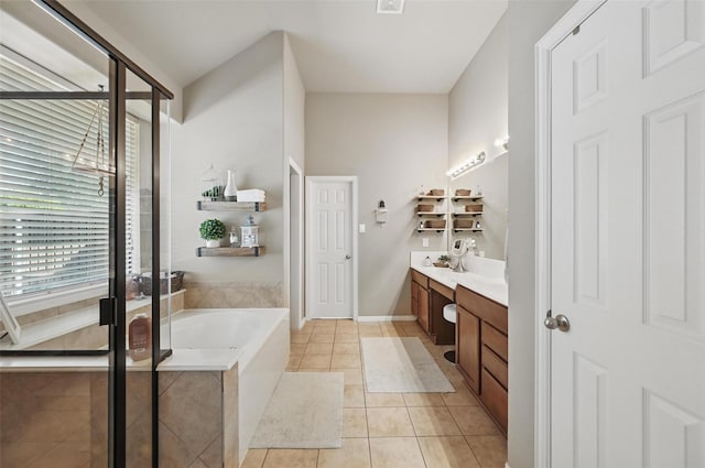 bathroom featuring a shower stall, tile patterned floors, double vanity, visible vents, and a bath