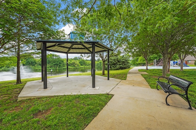 view of property's community featuring a gazebo, a water view, and a yard