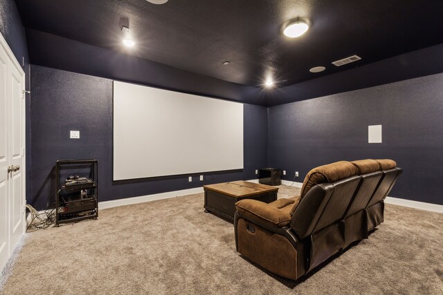 cinema featuring baseboards, visible vents, and carpet