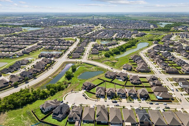 aerial view featuring a residential view and a water view